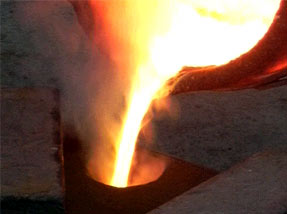 pouring the molten metal into the mould