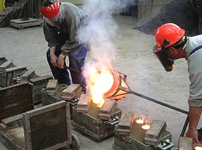 casting molten metal into moulds
